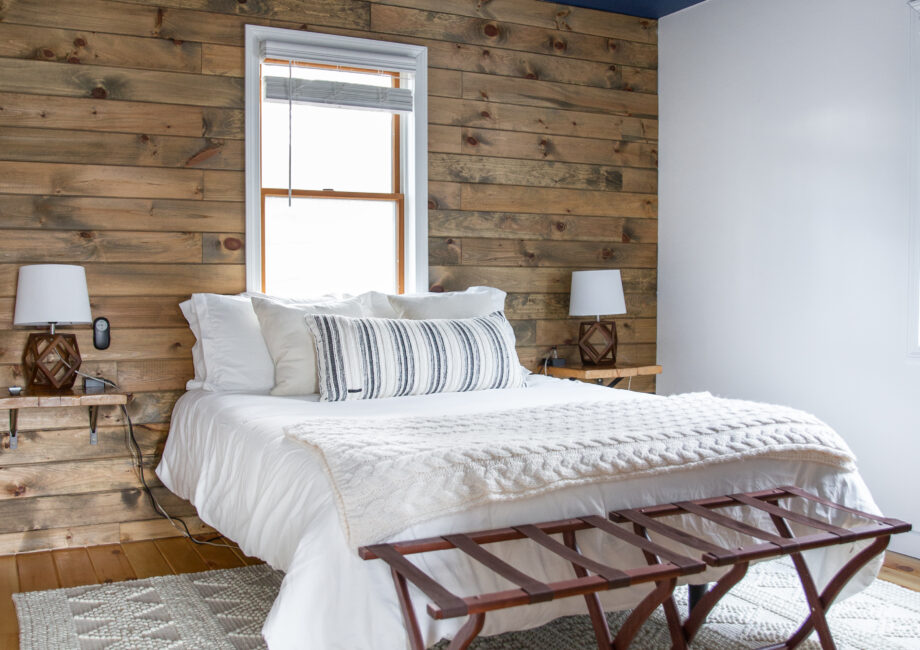 rustic style bedroom with dark blue ceiling and mountain theme